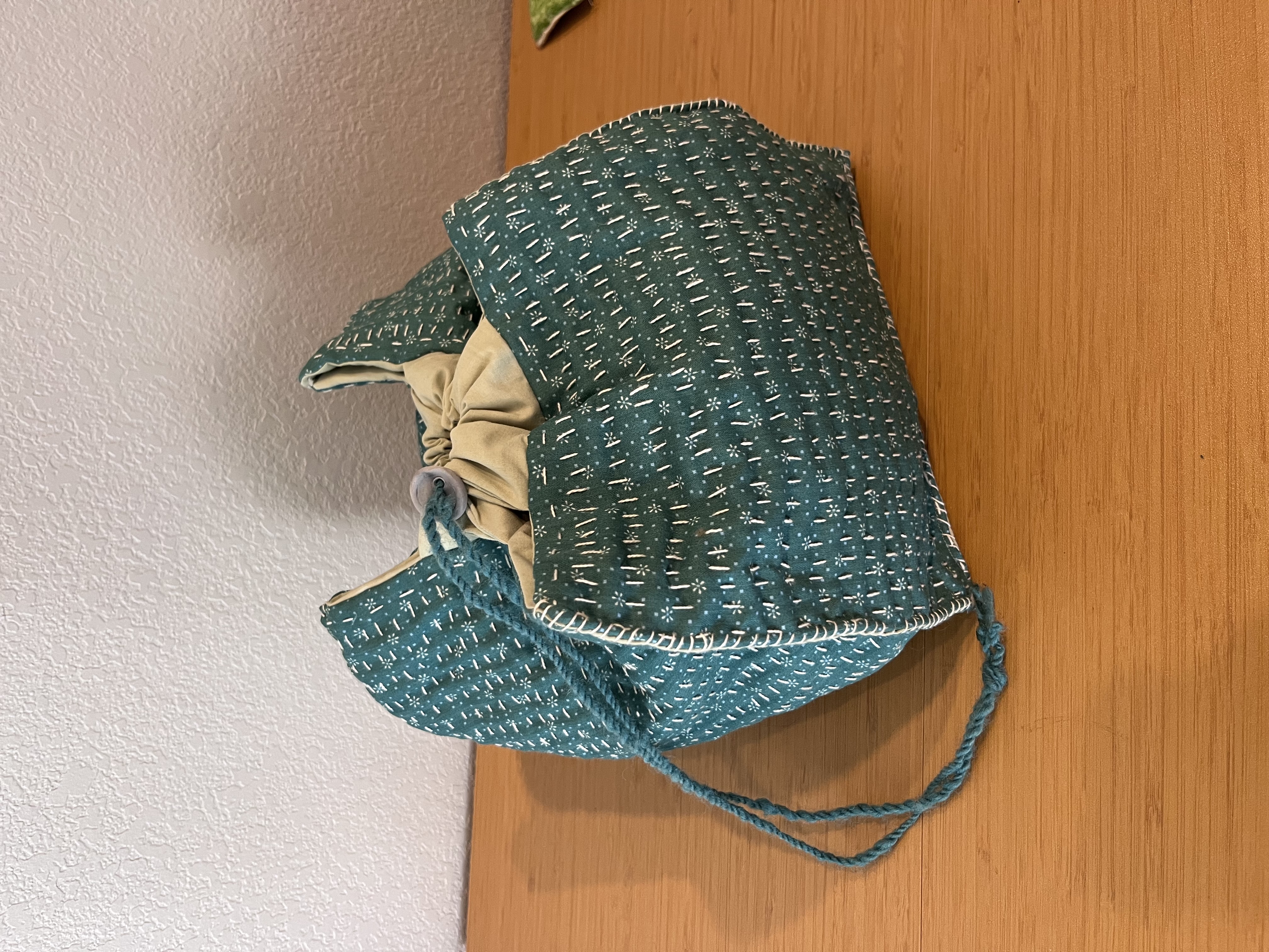 Photo of rice bag with decorative stitching.