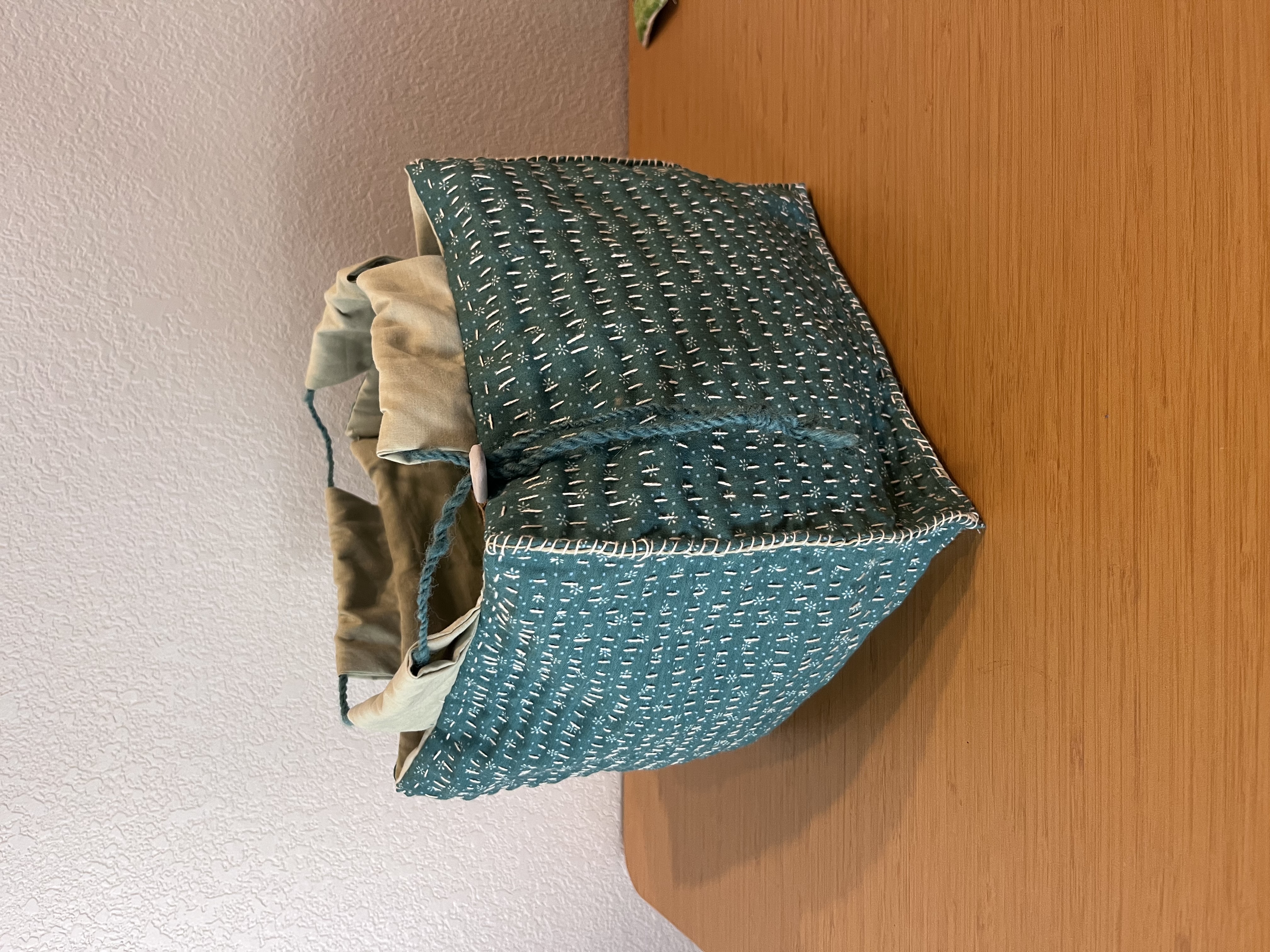 Photo of rice bag with decorative stitching.