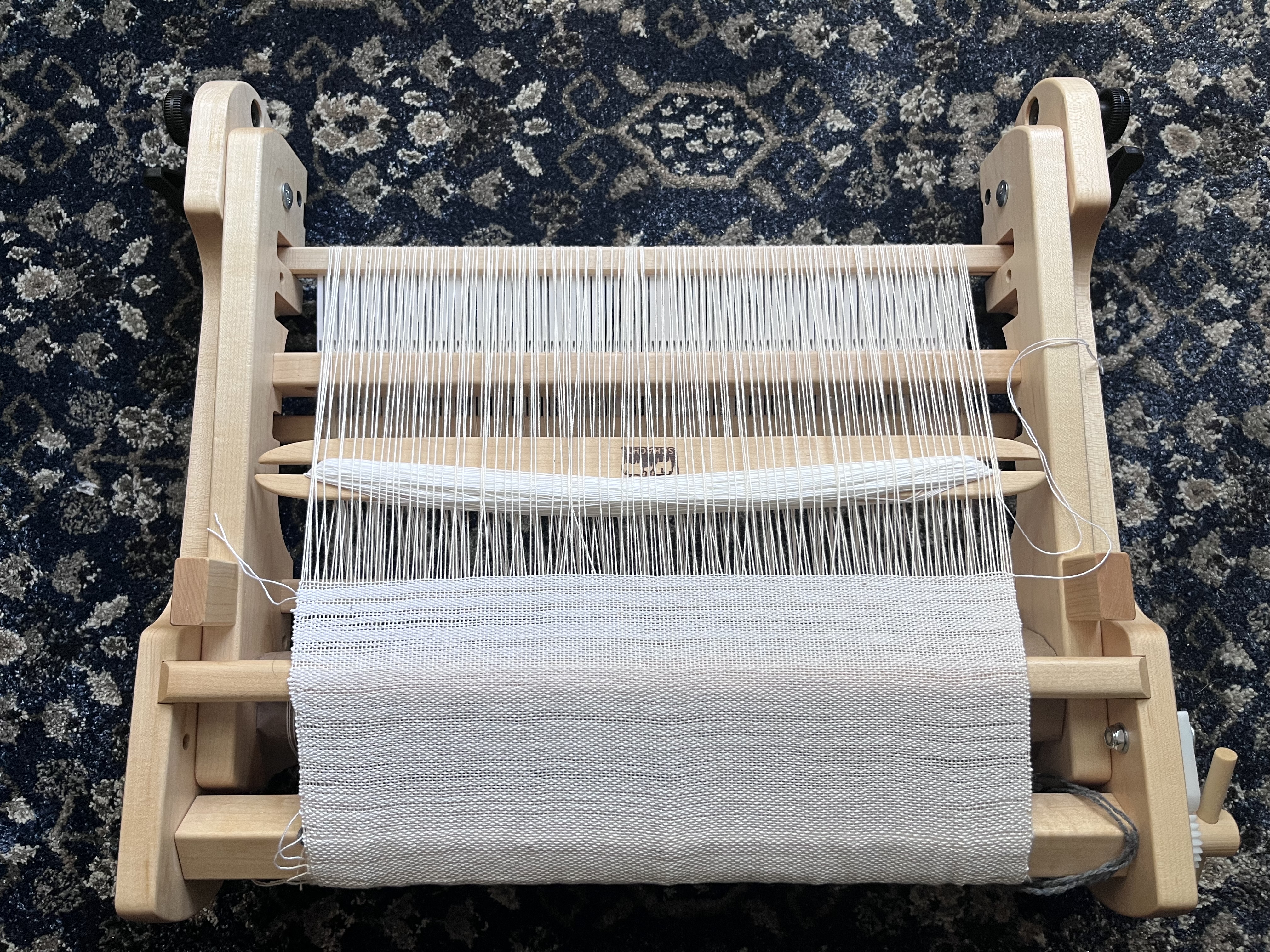Photo of loom warped and folded closed for storage.