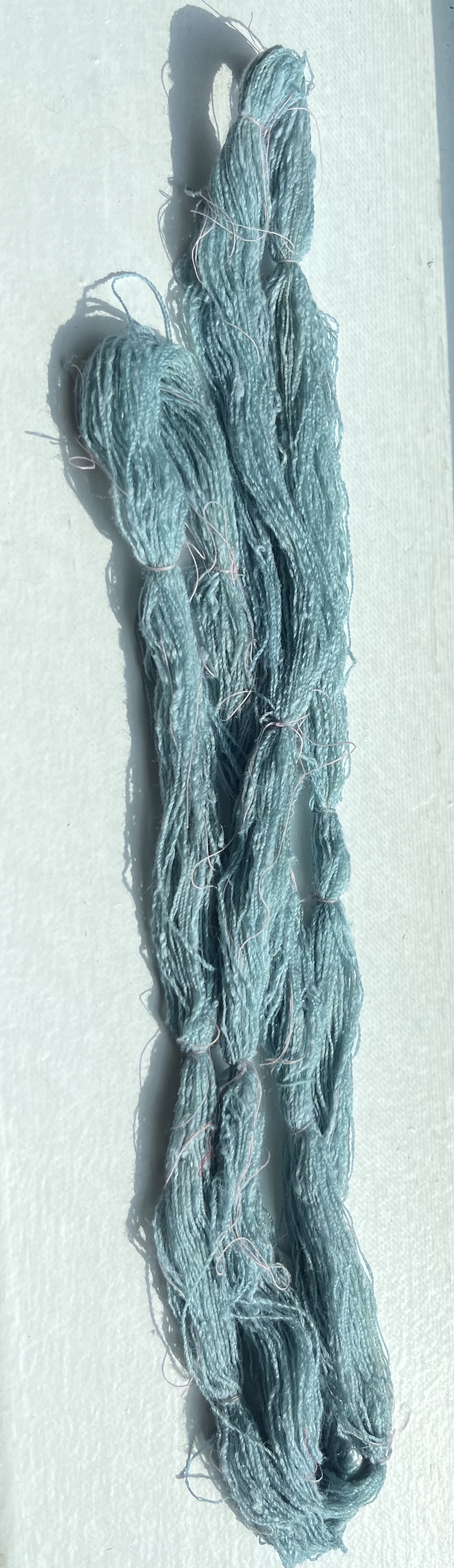 My First attempt at indigo dyeing, done on handspun silk.